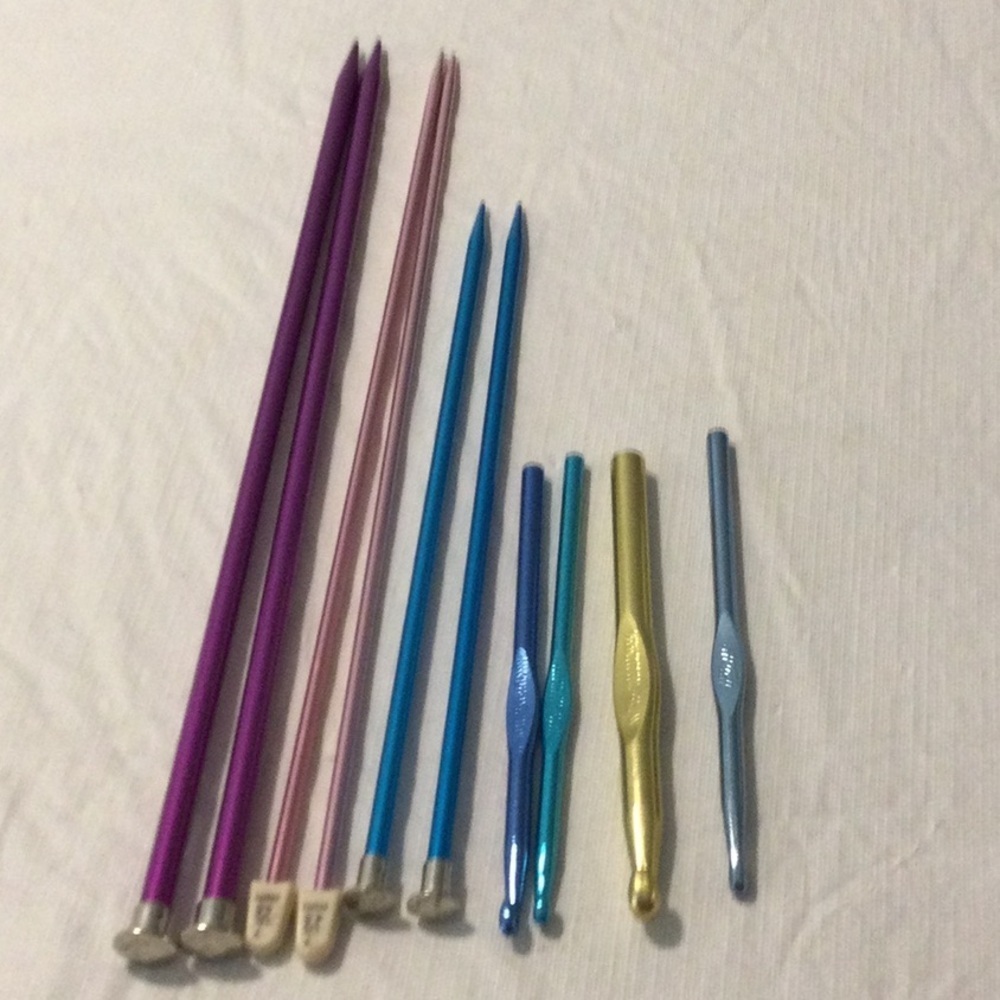 Colorful Knitting and Crochet Needle Set like new and  a Crochet book